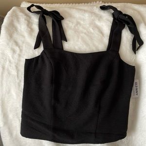 Black tank with tie straps.  Brand new
